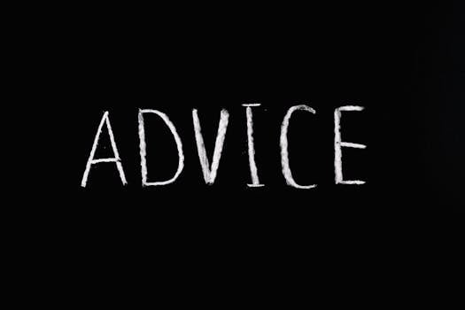 Inspirational word 'Advice' written in white chalk on blackboard.